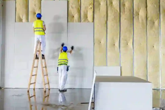 men-putting-up-drywall-540x360